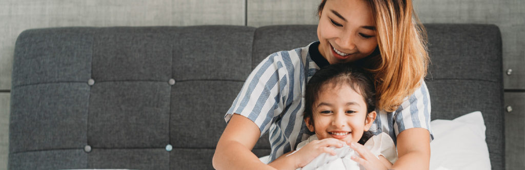 Mother and child smiling